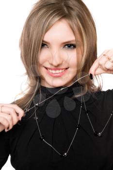 Royalty Free Photo of a Woman Holding a Strand of Her Necklace