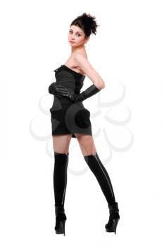 Royalty Free Photo of a Woman in a Black Dress and High Boots