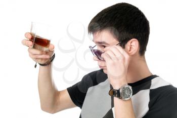Royalty Free Photo of a Young Man With a Glass of Whiskey