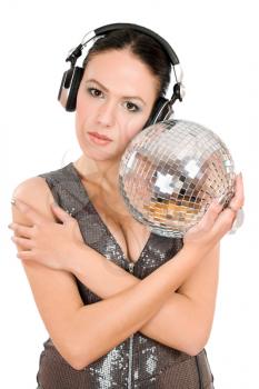 Nice young woman in headphones with a mirror ball. Isolated