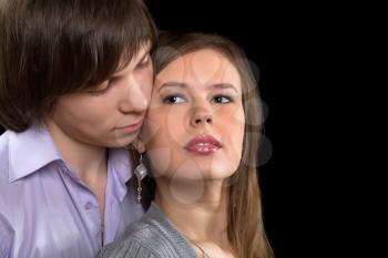 Closeup portrait of a young couple. Isolated