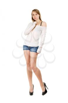 Young woman wearing blue jeans shorts, white blouse and black shoes with bewildered look. Isolated