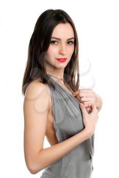 Beautiful young lady posing in grey dress. Isolated on white