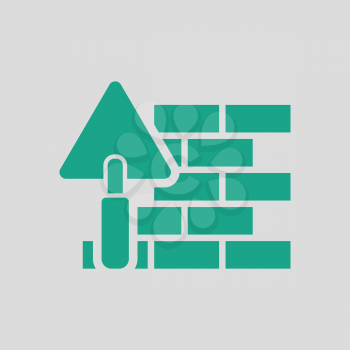 Icon of brick wall with trowel. Gray background with green. Vector illustration.
