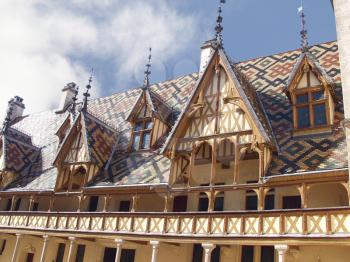 Royalty Free Photo of the Mosaic Roof Hospice in Htel-Dieu de Beaune, France