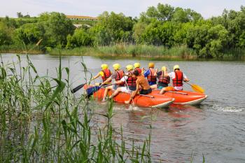 NIKOLAEV, VILLAGE GRUSHEVKA, UKRAINE - MAY 23, 2014: Rafting tourists with an experienced instructor on the river Southern Bug