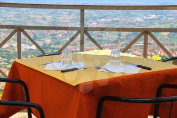 Tables outdoor restaurant in the fortress of San Marino.