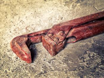 old wrench on concrete closeup