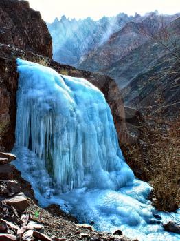 small frozen mountain waterfall close-up