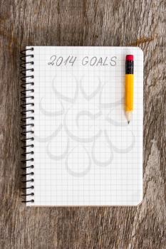 Notebook with pencil and goals of year 2014