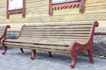 Vintage wooden bench in a yard of old house