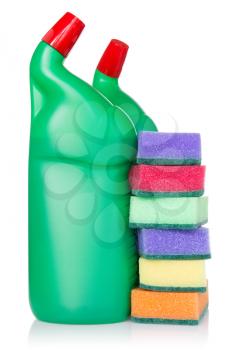 Plastic bottles of cleaning products and kitchen sponges. Isolated on white background