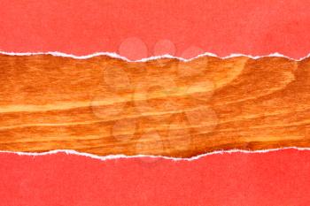 Wooden background with border of red torn paper 