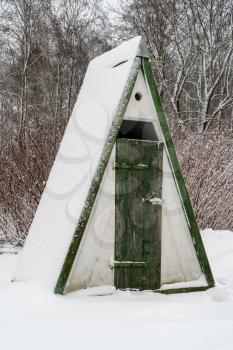 Outdoor village toilet in winter season