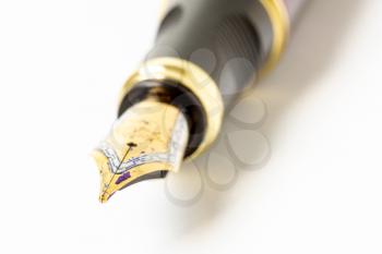 Tip of the fountain pen over white background,macro,close-up view