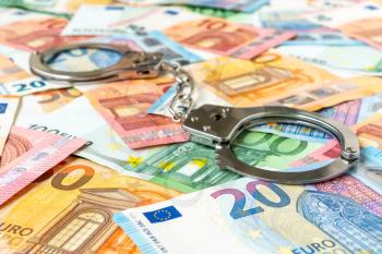 Euro banknotes and metal handcuffs. Concept For Corruption or Fraud