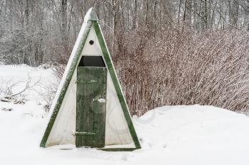 Outdoor village toilet in winter