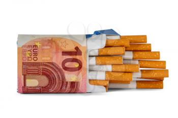 Package of cigarette wrapped in a 10 Euro banknote. Smoking is expensive.