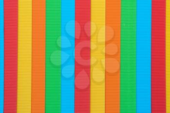 Striped colorful embossed paper. Colored paper background. 