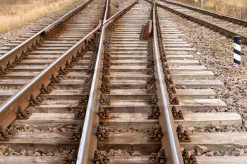 The way forward railway. Railroad, rails, fork rail, two ways, two directions.
