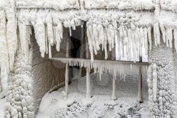 Frozen floodgate of small dam on the river.Extremely Cold Weather .