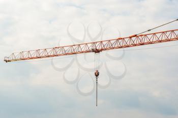 Long boom of high-rise building crane. Arm of tower construction crane.