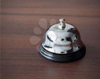 Service bell ring on wooden background