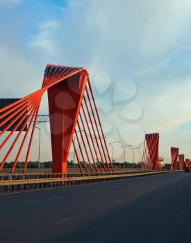 Orange cable bridge in sunset time
