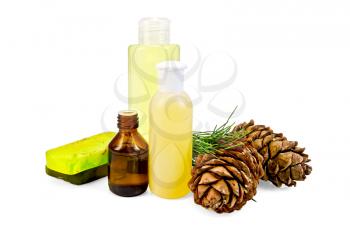 Cedar oil in a bottle, two cedar cones, two green homemade soap, body lotion, shower gel isolated on white background