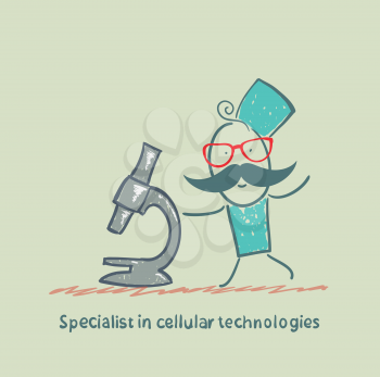 Specialist in cellular technologies looks looks through a microscope