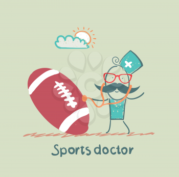 Sports doctor listens to a stethoscope football