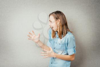 girl gets angry and shouts, waving his arms