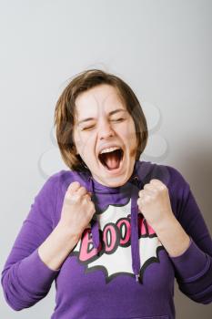 Excited, happy girl with fists up showing success