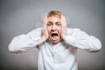 portrait of young man screaming