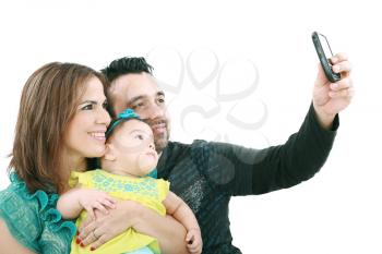 Closeup of happy family smiling over white background taking self portrait 
