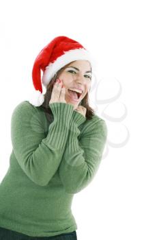 surprised christmas woman wearing a santa hat smiling isolated over a white background 
