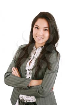 portrait of a happy young business woman standing with folded hand against white background 
