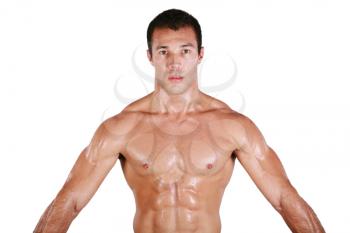 Muscular shirtless man after work out, looking at camera