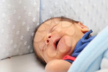 Newborn smiling in his dream