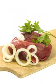 Royalty Free Photo of Meat on a Cutting Board