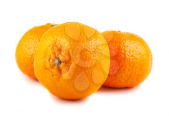 Three ripe tangerines isolated on white background