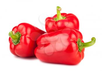 Three sweet red peppers isolated on white background