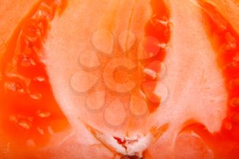 Red tomato slice macro shot background
