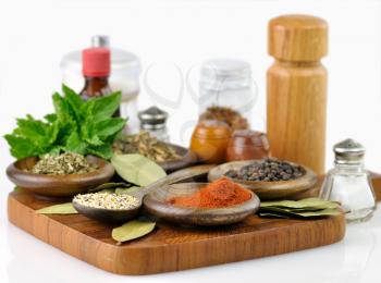 spices arrangement on a wooden board , close up