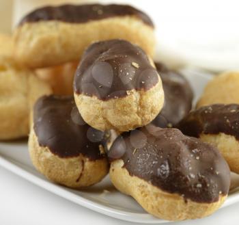 Close Up Of Eclairs On A White Plate