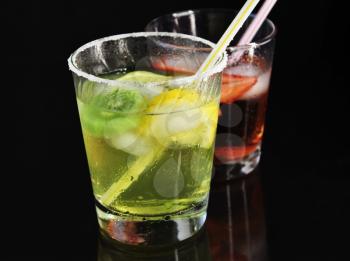 colorful fruit cocktails with ice cubes