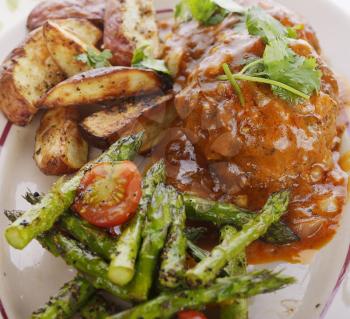 Salisbury Steak Patties With Roasted Asparagus Tomatoes And Potatoes