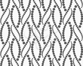 Monochrome dotted texture. Abstract seamless pattern. Ornament made of dots.Textured with dots wavy snakes.
