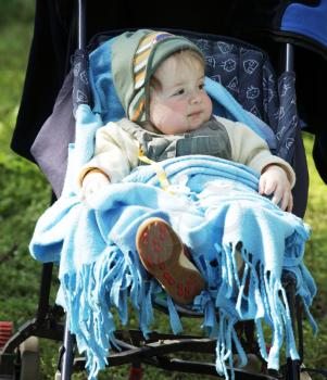 Royalty Free Photo of a Child in a Stroller