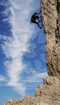 Royalty Free Photo of a Person Rock Climbing